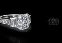 Leon Mege bespoke three-stone ring with a cushion diamond trapezoids and fleur-de-lis filigree r1221