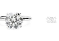 Leon Megé modern solitaire with a round diamond in single claw prongs on a uniform shank r8608