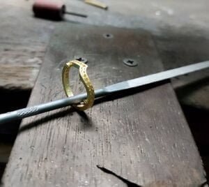 jewelry making a ring on the jewelers bench